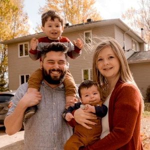family in front of house